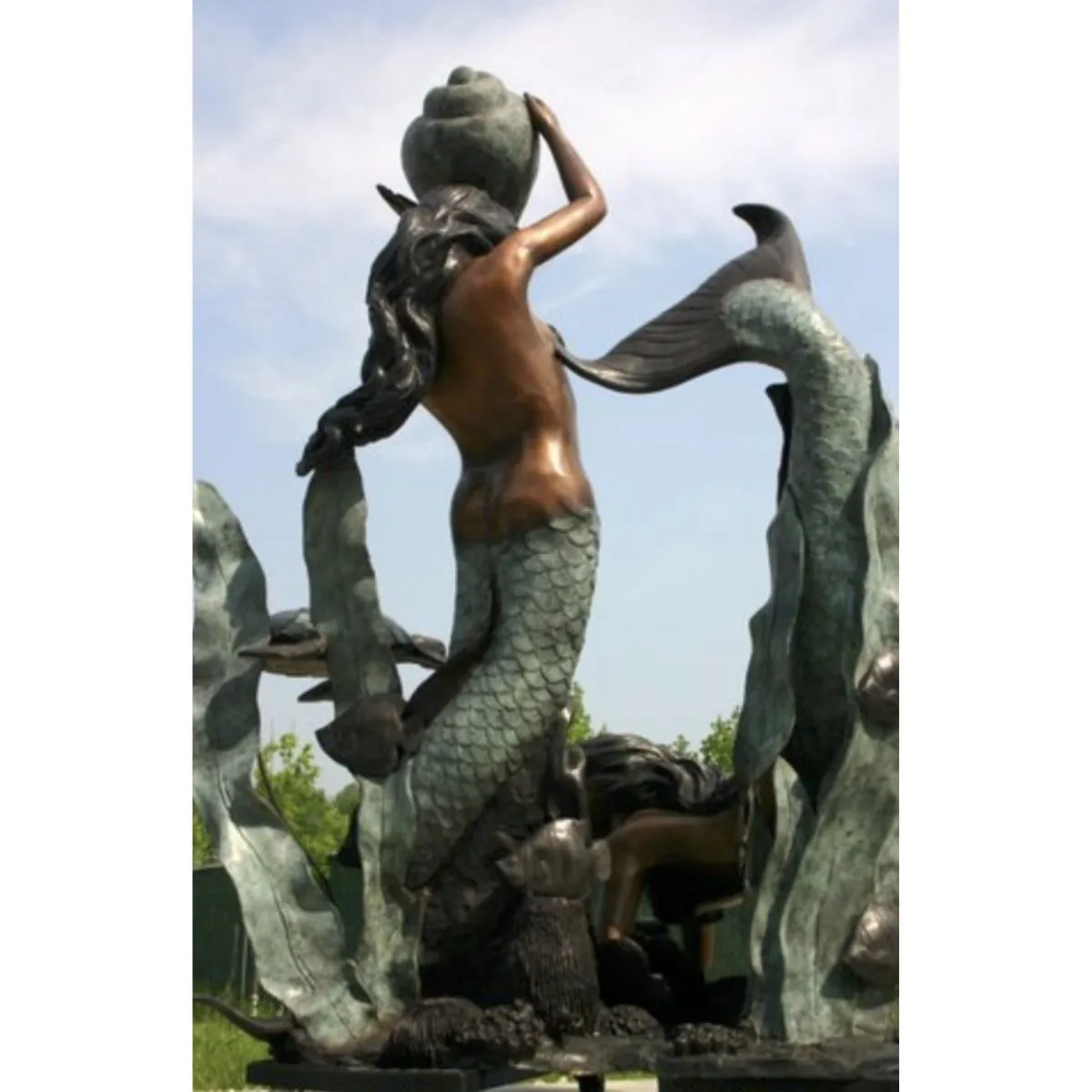 Mermaids Playing with Sea Turtle