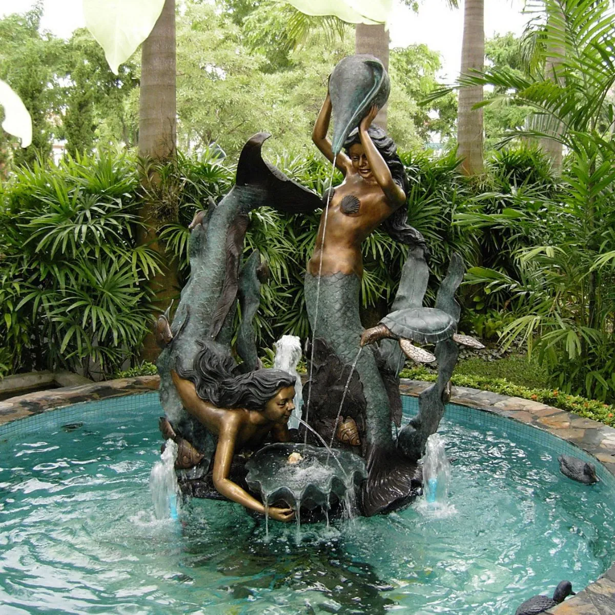 Mermaids Playing with Sea Turtle